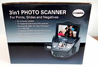 Retail box showing Cobra 3-in-1 Photo Scanner branding and features including 12 megapixel stand-alone film scanner, compatibility with Windows 98 to 7, 2.4-inch LCD screen, USB 2.0 interface, and SD/MMC/MS/MS-PRO card slot.
