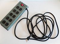 Full view of the power bar showing all 10 outlets, power cord, and switch.