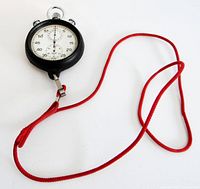 Front view of Heuer stopwatch with dial and red lanyard shown.