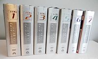 Photo of all 7 seasons of Star Trek The Next Generation metal DVD cases lined up side by side with clear season numbering and branding.