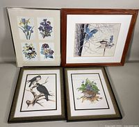 Four framed prints including one floral with four squares of flowers, one bluebird with birdhouse, and two separate bird prints.