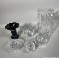 Full group of 6 glass items including pitcher, bowl, vases and smaller objects on white background