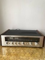 Front view of Kenwood KR-3090 showing aluminum faceplate and wooden side panels