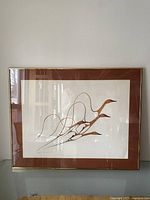 Photo showing full framed print of stylized birds in flight by Benjamin Chee Chee.
