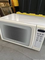 Front view of the large white Panasonic microwave convection oven showing the door and part of control panel.