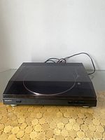 Front view of black Sony PS-LX250H turntable with dust cover closed, showing the Sony logo and power cord in the back.