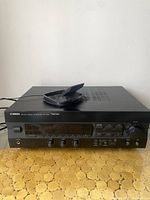 Yamaha AV Receiver RX-V293 front view with visible control knobs, digital display, and branding.