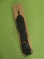 Full view of the Sail game carrier strap on cardboard packaging with logo and length indicated