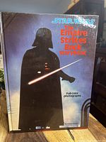 Front cover of 1984 Star Wars The Empire Strikes Back Storybook showing Darth Vader silhouette and title with full-color photographs label.