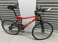 Side view showing overall frame, wheels, handlebars, seat and pedals