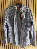 Blue gingham check button-down collar dress shirt on hanger showing front view, new with tags attached.