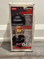 Photo of original box showing Coleman Adjustable Gas Lantern branding and product image.