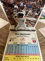 Close-up of Don Mattingly 1991 pop-up baseball card showing detailed player batting image and full statistical data.