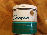 Front and side view of vintage Cameo menthol cigarette tobacco can showing brand and condition.