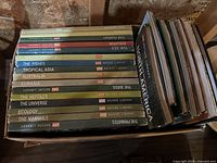 Side view showing set of 11 'Life Nature Library' titles alongside 9 other encyclopedias, laid flat.