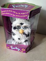 Original Dalmatian spotted Furby toy inside display box with visible wear on box edges