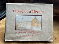 Front cover showing book title and illustration of a building.