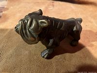 Side angle showing bulldog figurine details and solid metal appearance