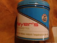 Side angle showing Player's branding in red text on blue and white background with circular logo.