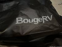 Close up of BougeRV logo on black storage bag material.