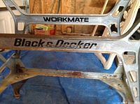 Close-up of metal leg frame showing Black & Decker and Workmate branding