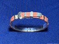 Front angle photo of the vintage 925 sterling silver Mexico Taxco coral bracelet showing coral inlays and silver detailing.
