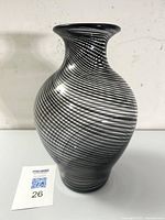 Full frontal view of vase showing the baluster shape, flared rim and black spiral filigrana pattern