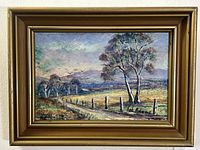 Frontal view of the oil painting showing rural landscape, fence posts, trees, hills and pastel sky, signed lower right by Val Adams