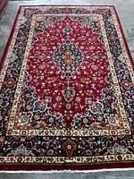 Full view of rug showing central medallion and borders