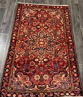 Full view of the Persian Arak rug on floor