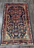 Full view of Hamadan hand-knotted Persian rug showing overall design, colors, and condition.