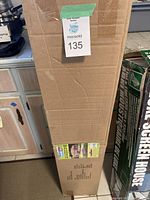 Full view of unopened standing box showing shipping and size details for the gazebo