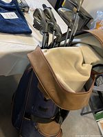 Photo showing 11 Turbo Plus XL-2 iron golf clubs in bag, clubs have silver clubheads and steel shafts.