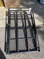 Full view of foldable steel mesh ramp assembled and unfolded