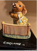 Front view of the Pendelfin Annette mouse figurine holding tennis racket, showing detailed facial expression and tennis net.