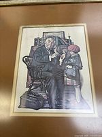 Framed print showing an elderly man and child with a toy, seated and standing respectively, in vintage setting.