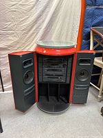 Front view with doors open showing stereo components and speakers