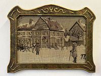 Front view of colonial tapestry with horse and carriage scene inside decorative wood frame with gesso detail