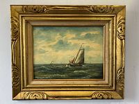 Frontal image of the framed marine oil painting showing overall condition, size, and detailed frame design.