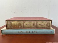 Spine view showing Nicholas Nickleby and On The Eve with Folio Society branding