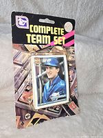 View of front sealed blister packaging with image of Blue Jays player and Complete Team Set title.