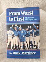 Front cover of the book showing the title, author Buck Martinez, and the 1985 Toronto Blue Jays team photo.
