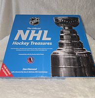 Front cover of the NHL Hockey Treasures book with Stanley Cup image and NHL logo, labeled as special edition with replicas of hockey memorabilia.