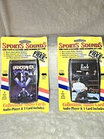 Front view showing two WWF Sports Sounds collectible audio cards still sealed in original packaging, featuring The Undertaker and The Rock.