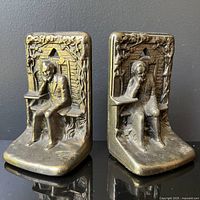 Pair of Judd Abraham Lincoln bookends with bronze finish and cast iron base shown from front angle.