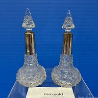 Front view of both bottles with stoppers in place