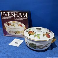 Full view of Evesham deep casserole with lid beside original box showing branding and design.