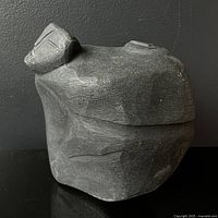 Front view of full carving showing mother’s profile and overall form