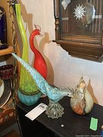 View of 4 art glass pieces including Murano signed orange bird and tall vase