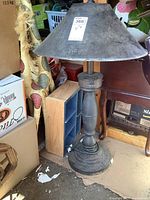 Side view showing the full height of the metal heater, weighted base, and conical shade with embossed 'HOT' marking.